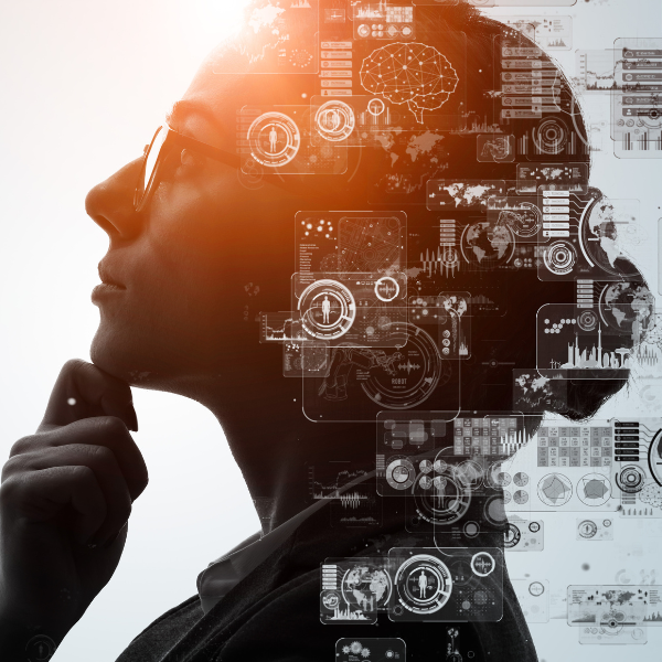 A woman with glasses looking at a screen displaying AI concepts and data in a UK business context.